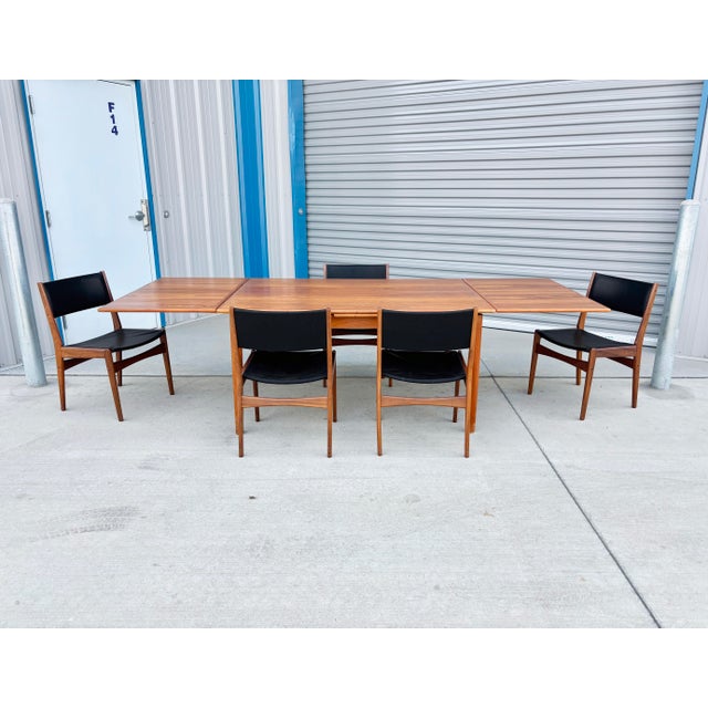 ✨ Danish Modern Teak & Vinyl Dining Set ✨ This stunning Danish modern dining set is the perfect blend of functionality and...