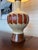 Beautiful ceramic and wood mid century/centemporary table lamp with original oversized drum-shaped shade. Features a drip...