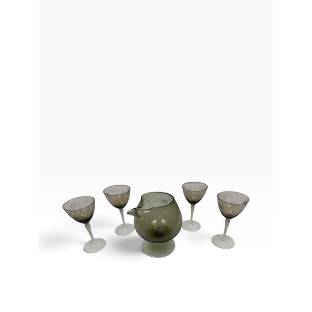 Elevate your home bar curation with this rare, breathtakingly elegant mid-century vintage cocktail pitcher and stemware...