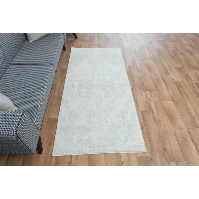 This vintage hand-knotted area rug is a semi-antique vintage area rug. The '70s Eastern region of Anatolian's unique rug...