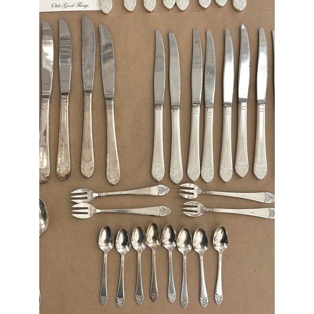 These pieces were used in to service the Waldorf Astoria Towers. Table setting for eight, with two serving spoons and four...