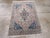 A vintage Persian Nain throw rug. The production of Nain rugs in central Persia began in the late 1930’s. This example,...