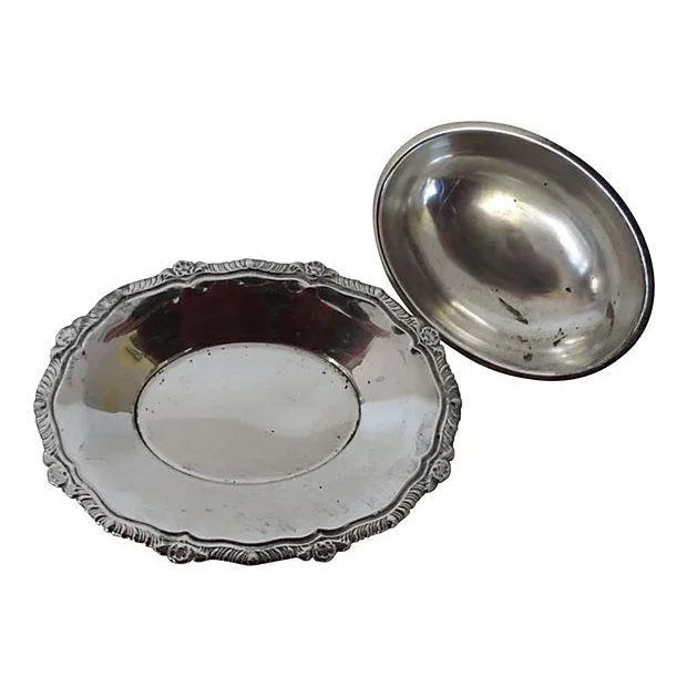 Domed oval silverplate butter dish. Marked "B. Rogers, Silver Plate" on underside. Dims: 7.5" L x 5.5" W x 3.25" H.