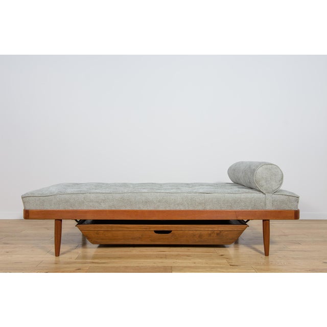 The Scandinavian teak daybed was manufactured in the 1950s by the Danish manufacturer Horsens Møbelfabrik. The frame...