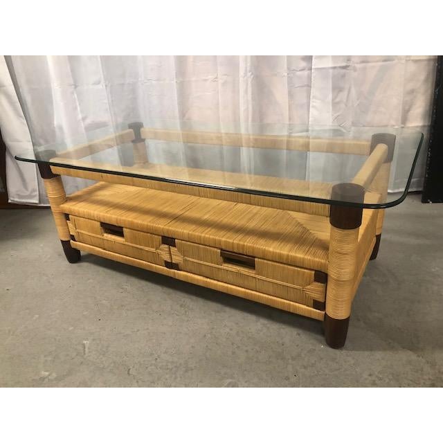 Chic 20th Century Donghia style woven rush wicker Merbau coffee table ready to float in your space. Table has two drawers...