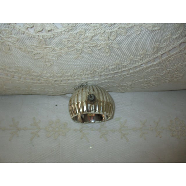 This is a Beautiful blown glass Ornament that features Blue Color with a Paper Foil Star, unique Ribbed Back pattern, deep...