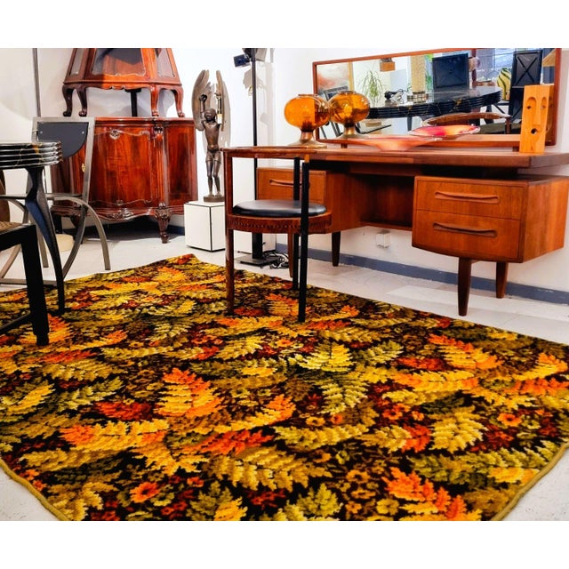 Scandinavian rug from the 1970s. The material is wool, the pattern is feathery fern leaves in bright yellow, orange and...