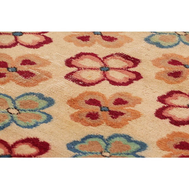 Hand-knotted in wool and originating from Turkey circa 1960 – 1970, this 3x7 vintage Zeki Müren runner is a unique...