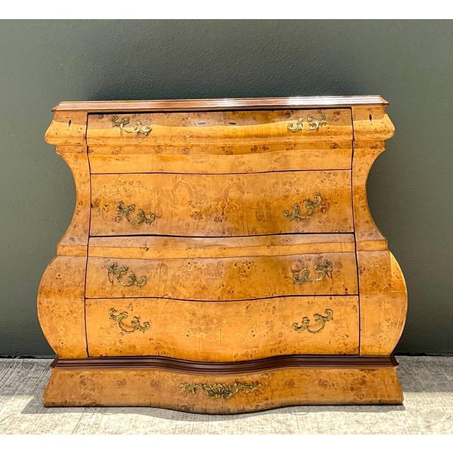 Elegant and richly detailed, this vintage bombe chest showcases the enduring beauty of French Provincial-inspired...