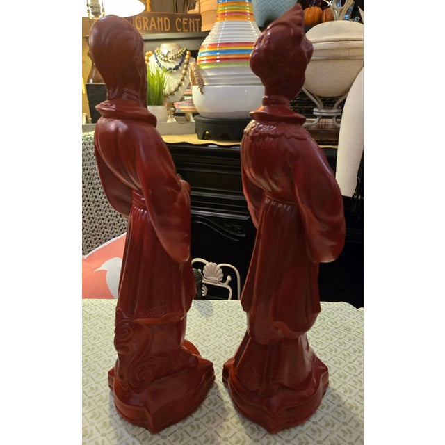 MCM Emperor and Empress with child Quan Yin Statues. Never used outdoors. Pair of red Statues. 16 inches tall Base 4.5 x...