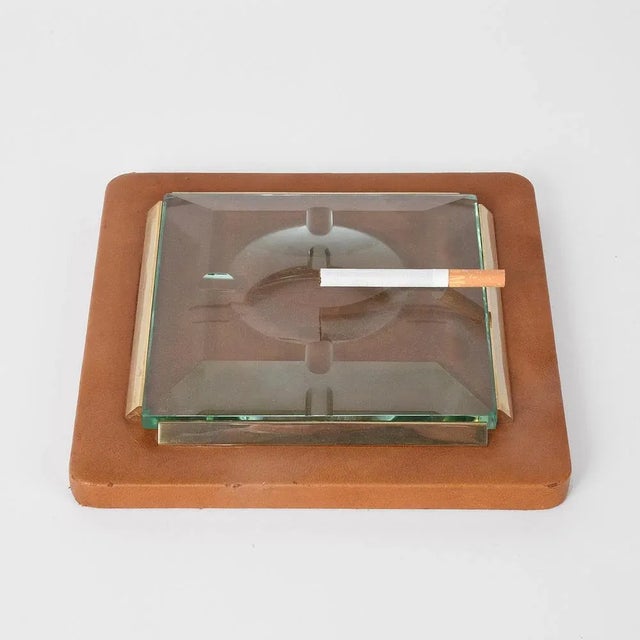 Fontana Arte 1970s. Ashtray in leather, brass and faceted glass. This piece is attributed to the mentioned designer/maker....
