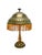 This lamp is a typical example of the transition from Late Art Nouveau to Early Art Deco. The brass lampshade with its...