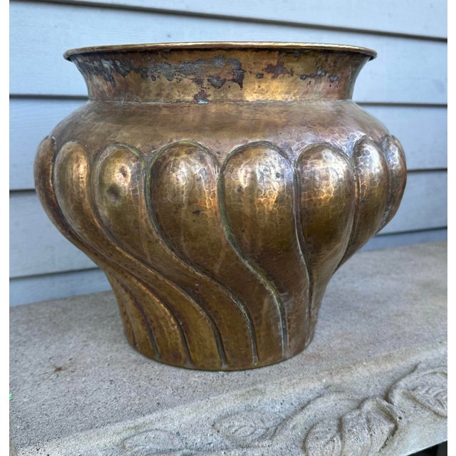A beautifully proportioned mid-century statement piece, this hand-formed solid brass jardinière showcases the distinct...