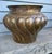 A beautifully proportioned mid-century statement piece, this hand-formed solid brass jardinière showcases the distinct...
