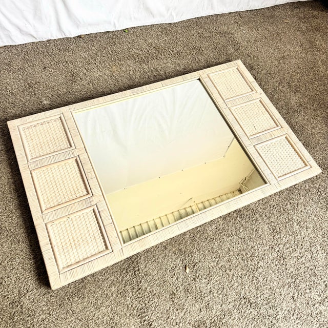 This charming boho chic mirror embodies relaxed coastal elegance with its white washed wicker frame and softly textured...