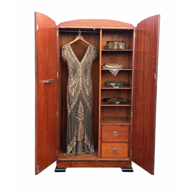 A beautiful compact Art Deco Wardrobe with doors veneered like a collage of specimen burr walnut veneers. The wardrobe...