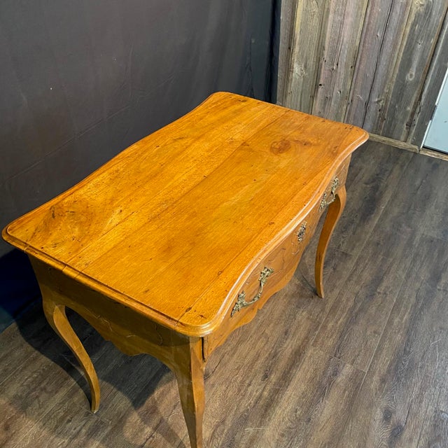 Classic French Louis XV 19th century console table or side table crafted in beautifully figured fruitwood, featuring a...