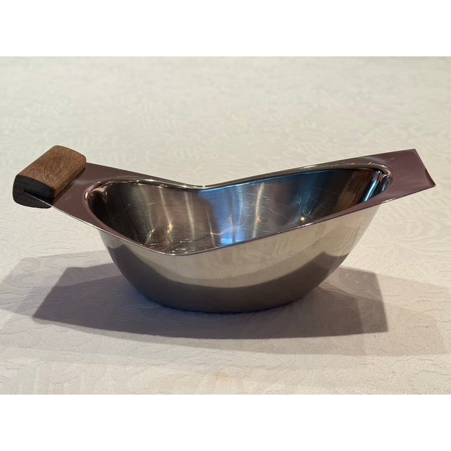 An exquisite manifestation of mid-century Nordic functionalism, this striking asymmetric "Crescent" serving vessel...