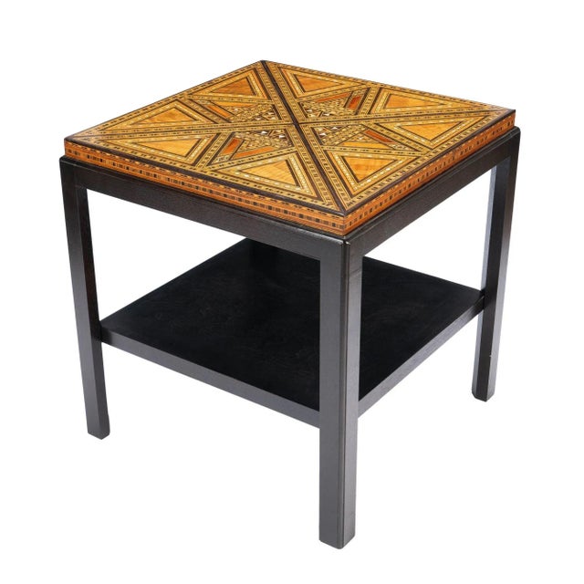 Damascus table top with geometric inlays of mixed hardwoods and Mother-of-Pearl. The table top has been remounted on a...