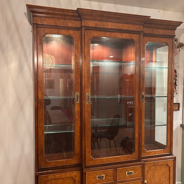 An impressive Century Furniture "Of Distinction" by Ray Sabota, china cabinet crafted in solid walnut. This cabinet...