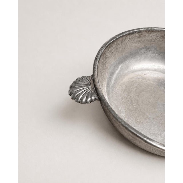 An exceptional mid-century silver-played dish from France, showcasing a beautiful blend of classical form and regional...