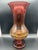 Blown glass vase in Amberina style, from the 1960s, featuring nuanced colors ranging from bright red at the top to amber...