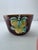 A newer majolica piece depicting orchard fruits. Wonderful brown glaze on the exterior in a bark like pattern. The...