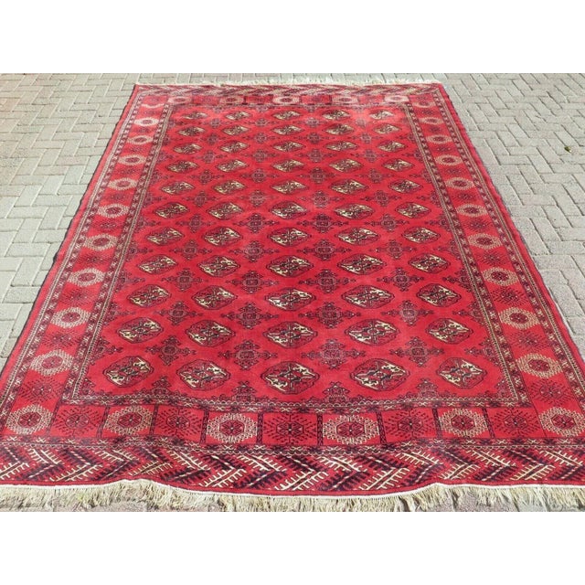 The bold red hues command attention, while the intricate patterns and motifs create a mesmerizing visual display. These...