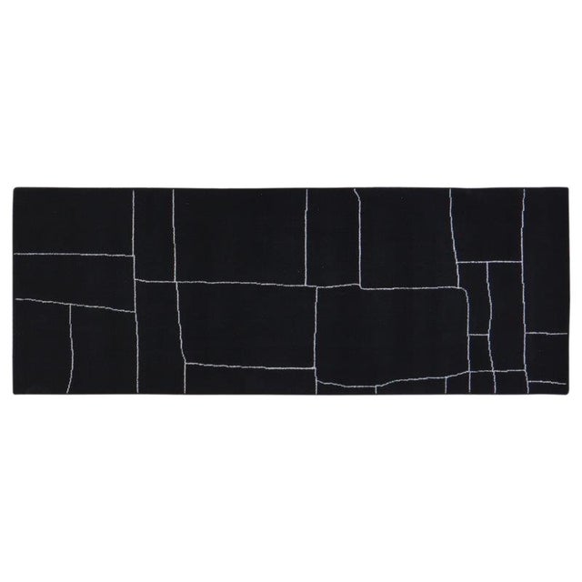 Hand-knotted with care using traditional rug-making techniques, this wool rug blends timeless craftsmanship with a modern...