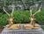 Pair Of Hollywood Regency Brass Stags. Offered is an impressive pair of vintage solid brass opposing reclining stags or...