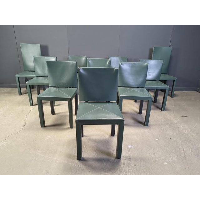 Set of 10 Arcadia dining chairs designed by Paolo Piva for B&B italia's Arcadia series. Upholstered in dark green leather....