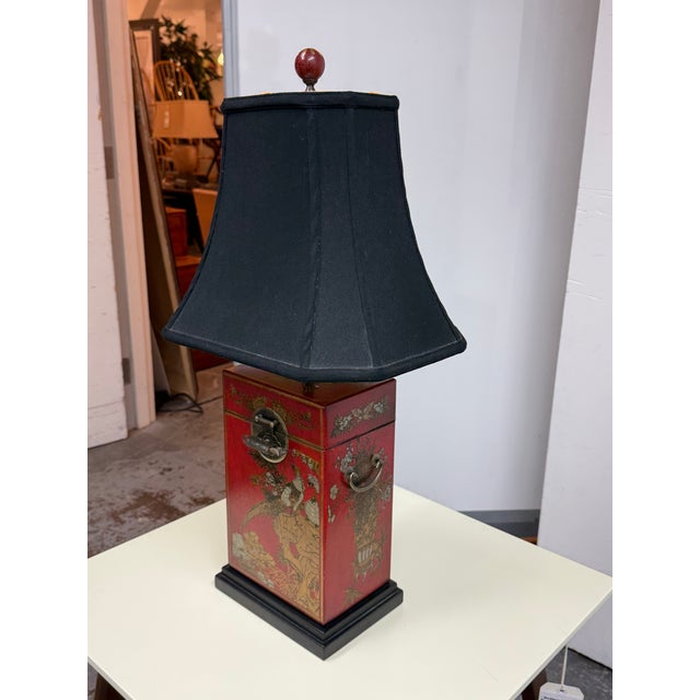 Design Plus Gallery presents a Red Chinoiserie-Style Box Table Lamp. This table lamp has a rectangular red lacquered-style...