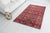 This is a vintage Turkish Oushak rug from the Mid 20th Century. The piece was hand-knotted.