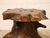 A wonderfully sculptural vintage side table crafted from a thick natural slab of richly figured wood set atop an organic...