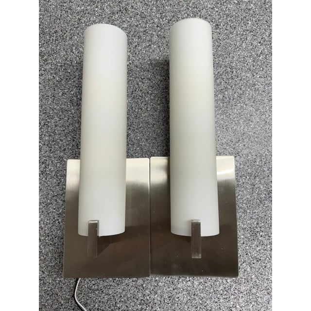 Design Plus Gallery presents a Pair of Tube Integrated LED + Etched Opal Glass Shade Wall Scones from George Kovacs. This...