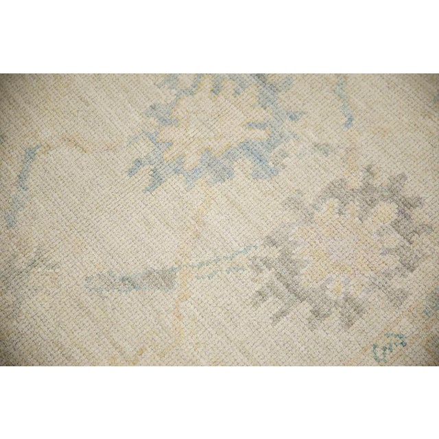 Enhance the beauty of your home with this elegant Turkish Oushak Hand Knotted Wool Oriental Rug, measuring 4' x 5'9". This...