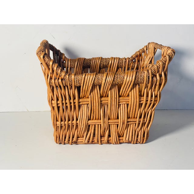 Vintage handmade wicker basket with handles.