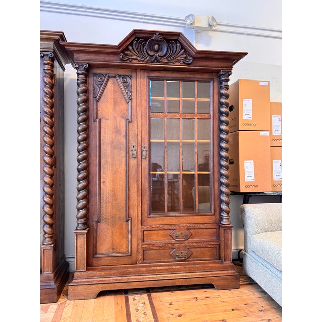 Design Plus Gallery presents a Renaissance Revival Oak Display Cabinet. This cabinet showcases carved oak construction...