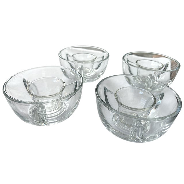Timeless set of four glass ice dishes by Libbey. Each two-piece set features a heavy, rounded base bowl and a separate...