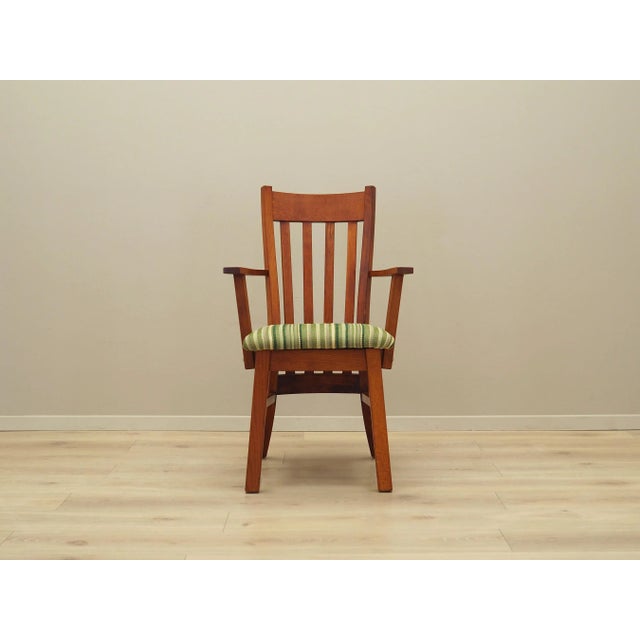The armchair was made in the 1970s, Danish production. The structure is made of teak. The wood has been refreshed, the...