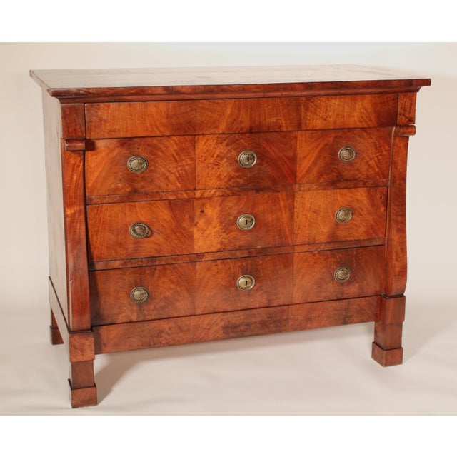 Continental restauration mahogany and flame mahogany chest of drawers, circa 1830. With a well figured mahogany top, below...