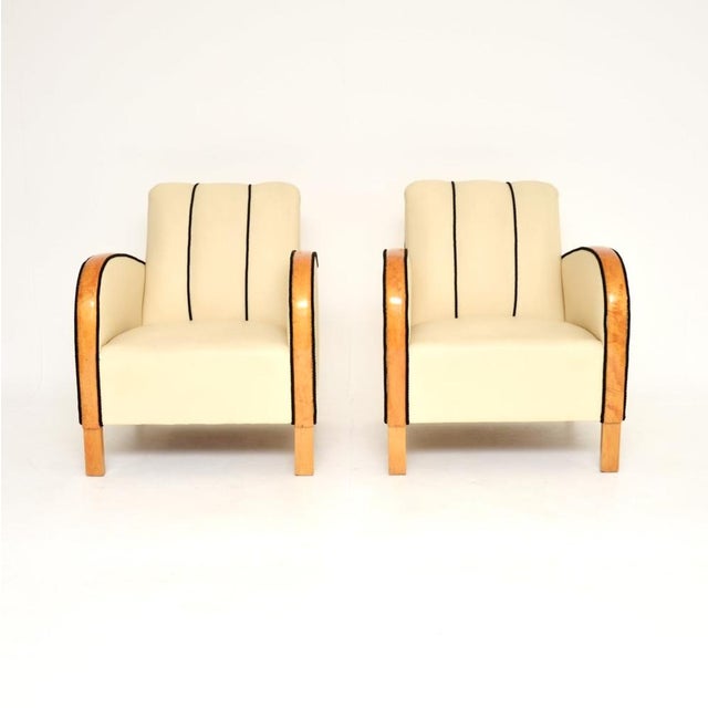 A stylish and very well made pair of Swedish Art Deco armchairs in leather and satin birch. They were recently imported...