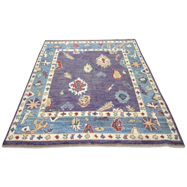Transitional Turkish Oushak hand knotted wool rug with natural colors.