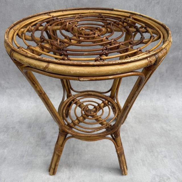 Round rattan side table from the 1950s. Handmade in the south of France. Low tabletop, 25 cm high.