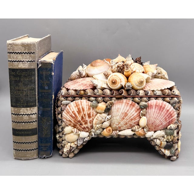 Exquisite, oversized, footed box made circa the 1970's. Lovely assortment of gorgeous shells embellish this unique piece....