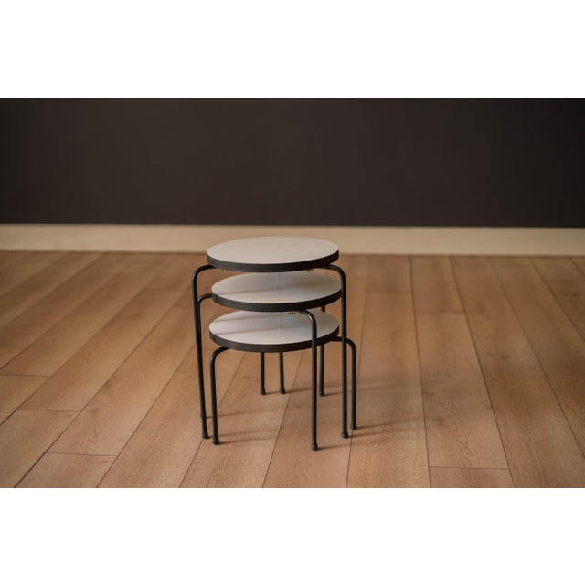 Set of three vintage round end table nesting stools in the manner of Luther Conover, circa 1950's. This black and white...
