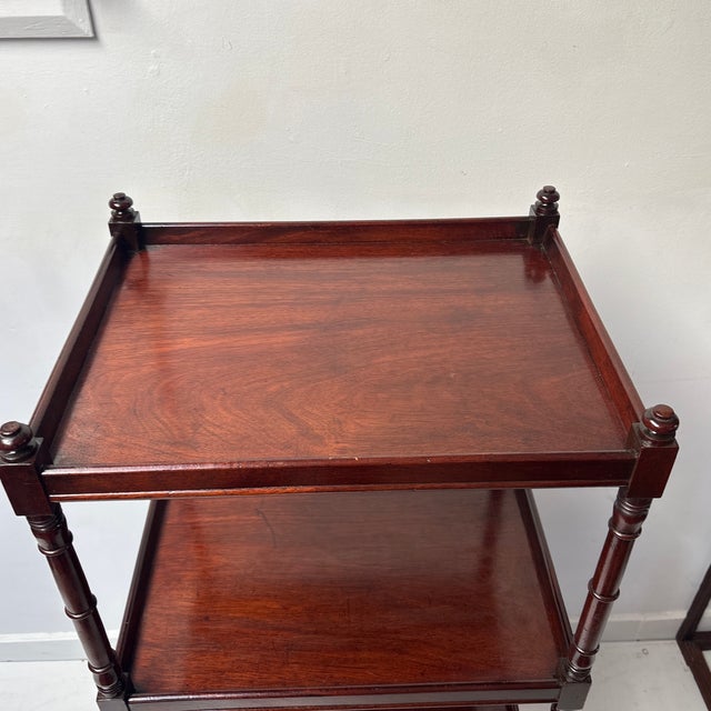 Antigue Mahogany Four Shelf Etagere in the Regency Style Circa 1820. Turned and Carved solid Mahogany posts feet and knobs