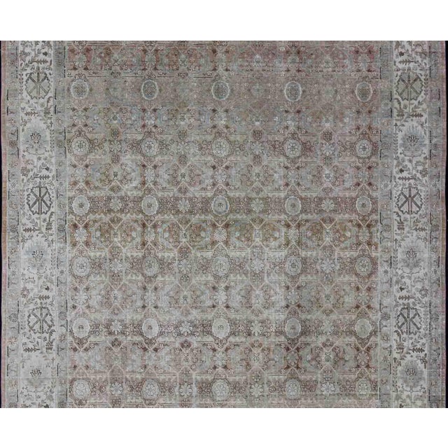 Antique Persian Tabriz rug with all-over floral design in ivory, blush, brown, light blue. Keivan Woven Arts / rug...