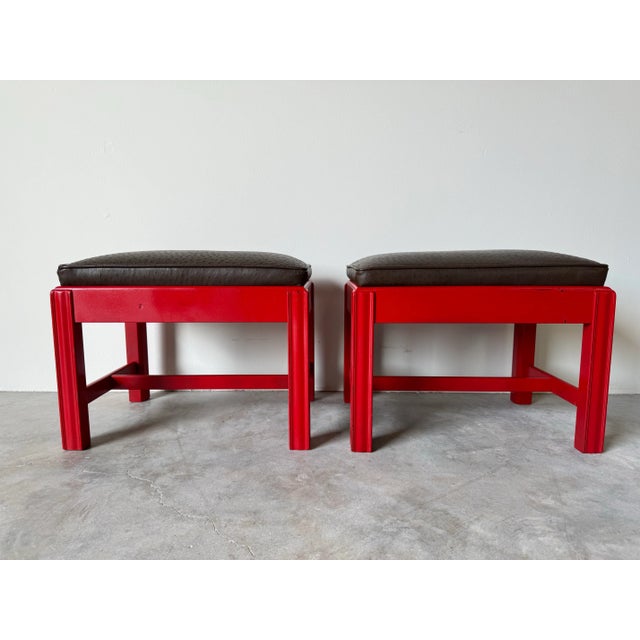 An elegant pair of Mid-century red lacquer solid mahogany frame & brown leather upholstered seats rectangular ottomans -...
