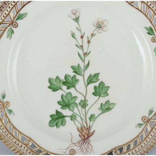 Royal Copenhagen Flora Danica openwork lunch plate in hand-painted porcelain with flowers and gold decoration. Model:...